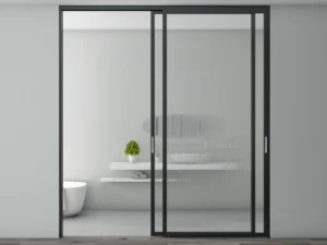 Modern aluminum sliding door opening to a bright dining area with sleek frames and energy-efficient glass panels.