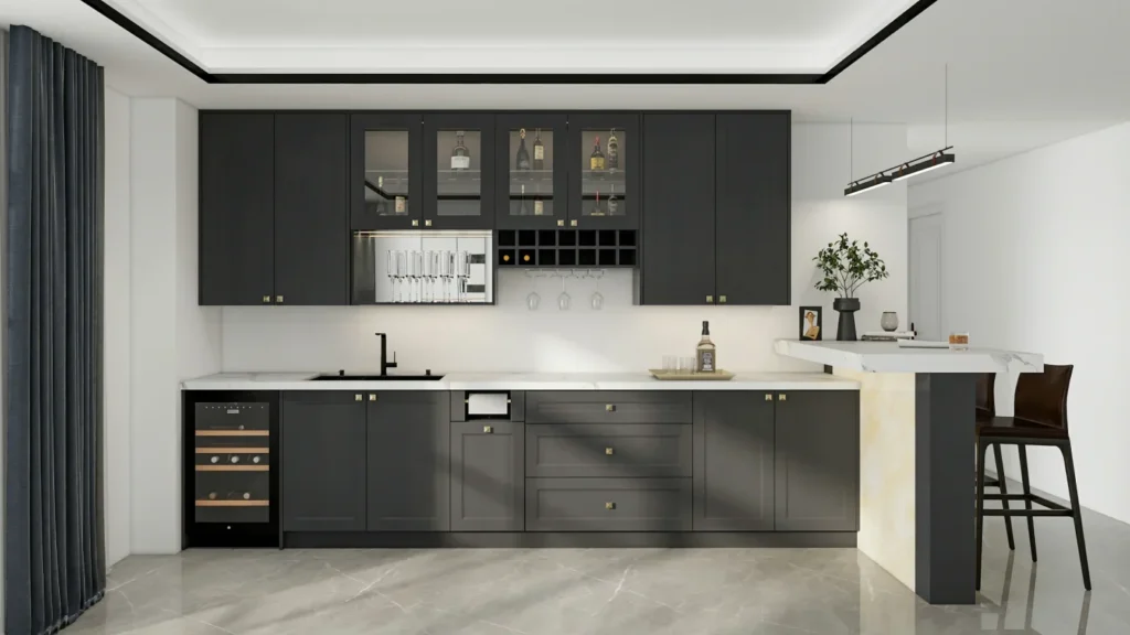 Grey shaker kitchen cabinets with nickel handles and white subway tiles.