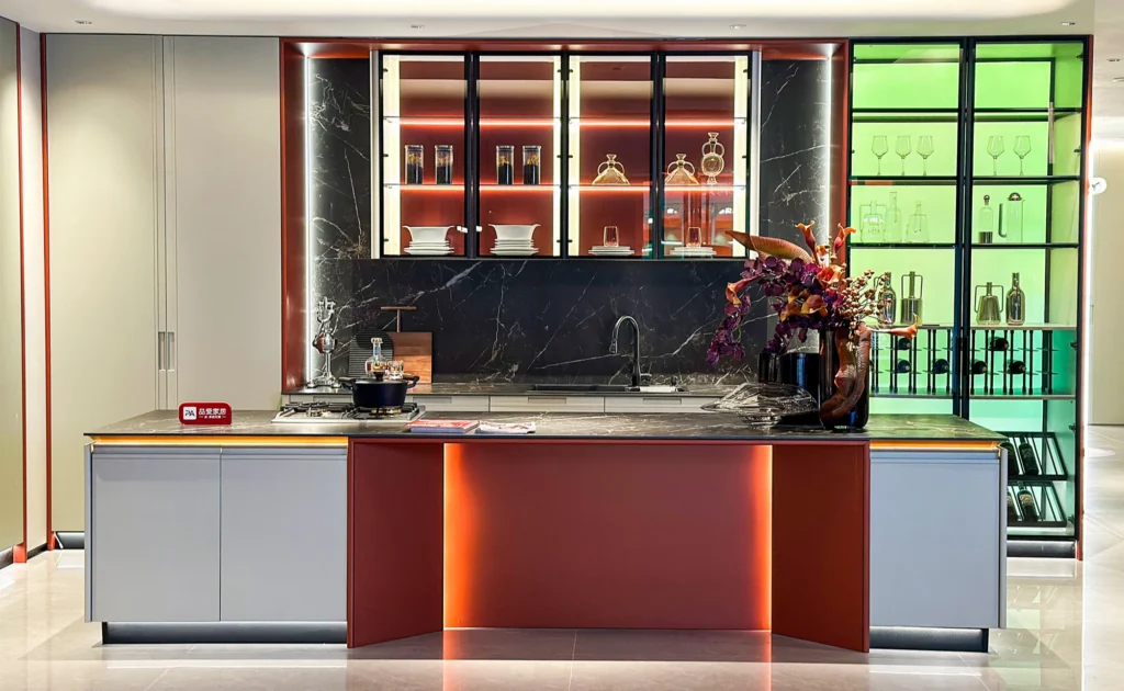 LED-integrated luxury kitchen cabinets with under-cabinet warm lighting.